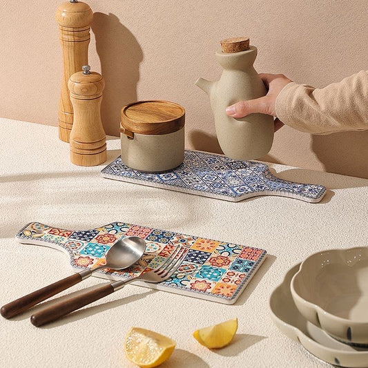 Ceramic trivet as table decor — vintage floral tile design displayed on dining table, MeowCeramics