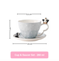 Cup and saucer set with penguin design, including measurements on a white background.