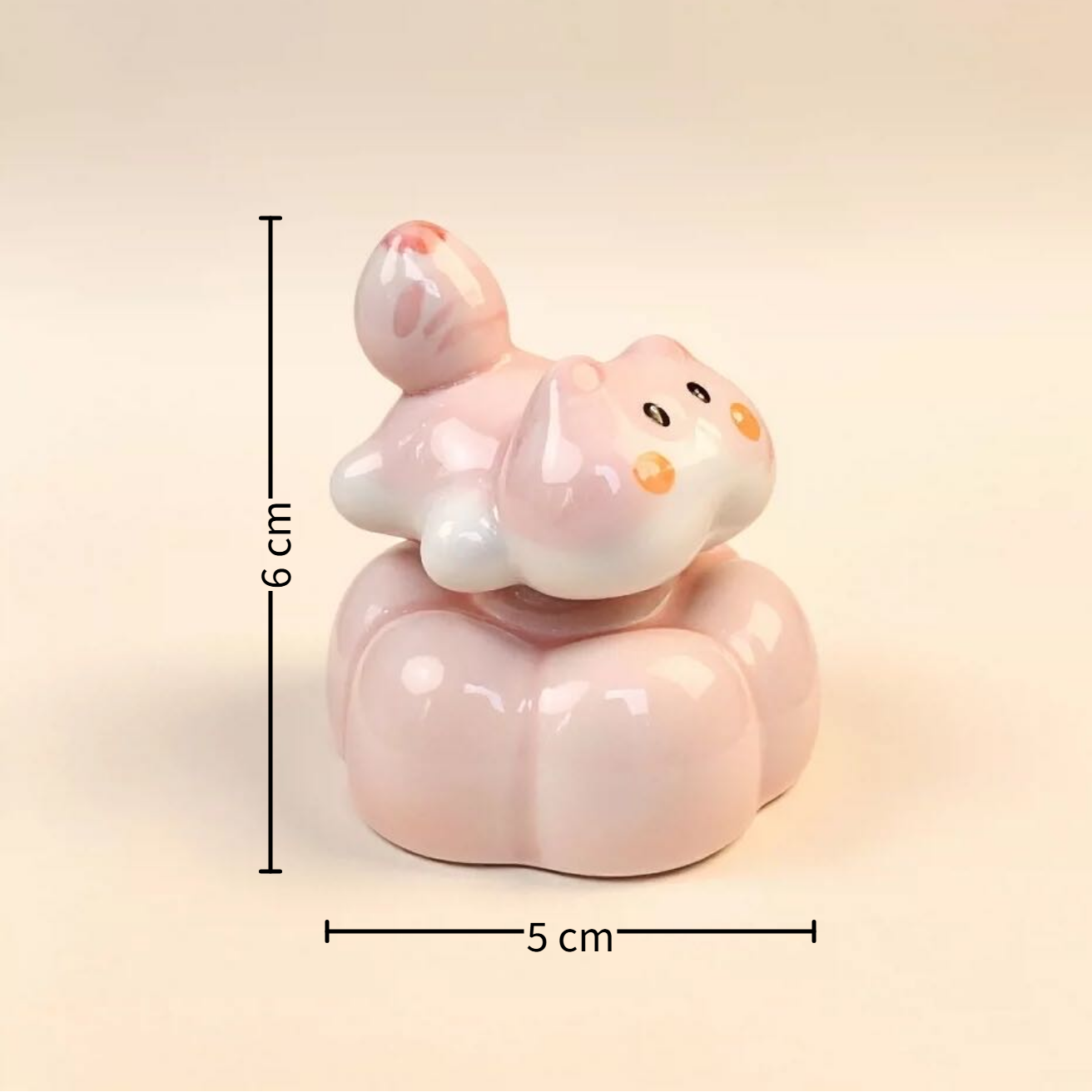 Spinning pink cat figurine assembly components — ceramic cat, base, copper bearing and adhesive, MeowCeramics