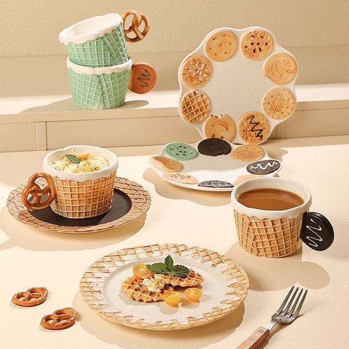 Café-themed table setting with waffle cups, plates, and cookies on a neutral background