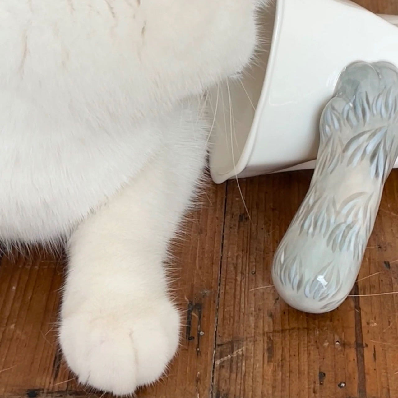 Handmade cat paw tilt mug — lifestyle display, optical illusion design, 250ml, MeowCeramics