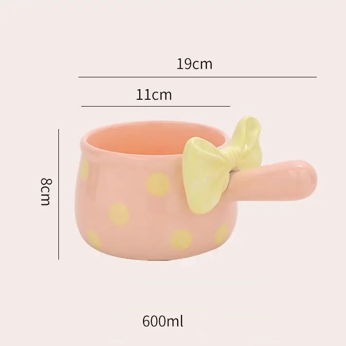 Pink cup with yellow polka dots and a yellow bow on a white background, showing measurements and capacity.