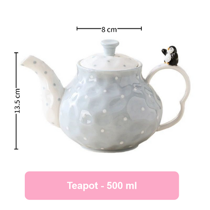 Ceramic teapot with penguin design, measurements, and capacity label on a white background