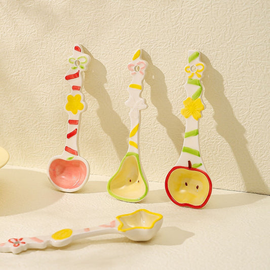 Fruit candy ceramic spoon — lifestyle display, hand-painted candy-stripe handle, MeowCeramics