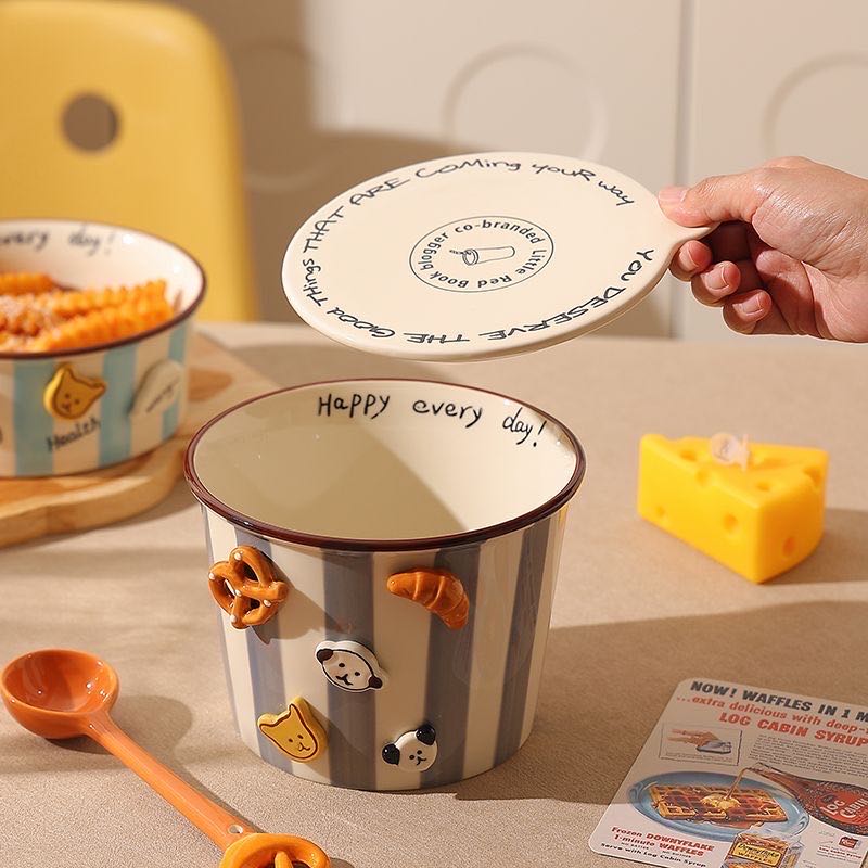 Ceramic mug with decorative elements on a kitchen counter