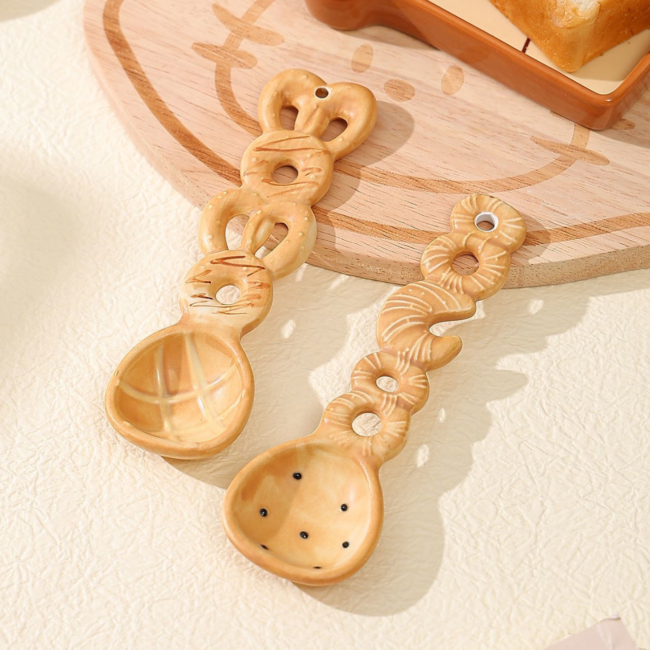 Bakery ceramic spoon handle detail — sculpted bread texture, underglaze painted, food-safe, MeowCeramics