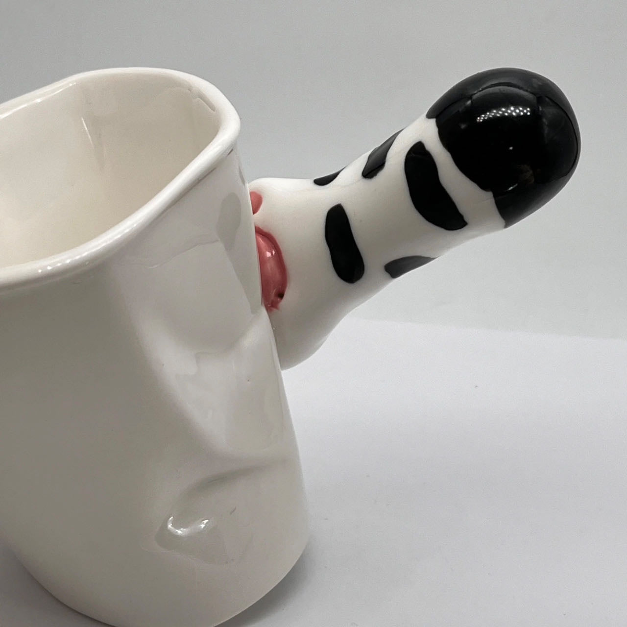 Cat paw mug in use — 250ml capacity, perfect for coffee and tea, MeowCeramics