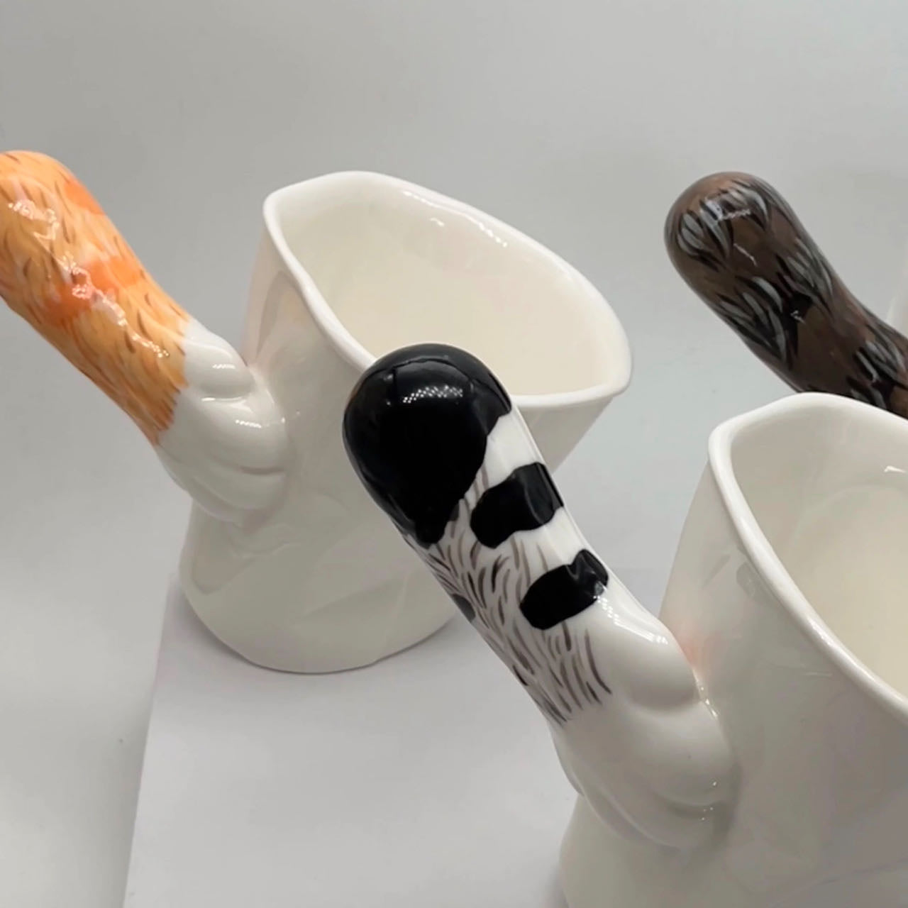 Cat tilt mug detail — clever two-plane base engineering, handmade ceramic, MeowCeramics
