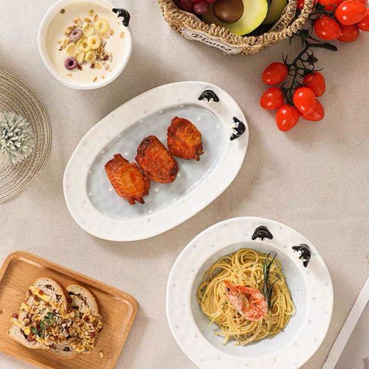 Assorted dishes including pasta, fruit, and bread on a table.