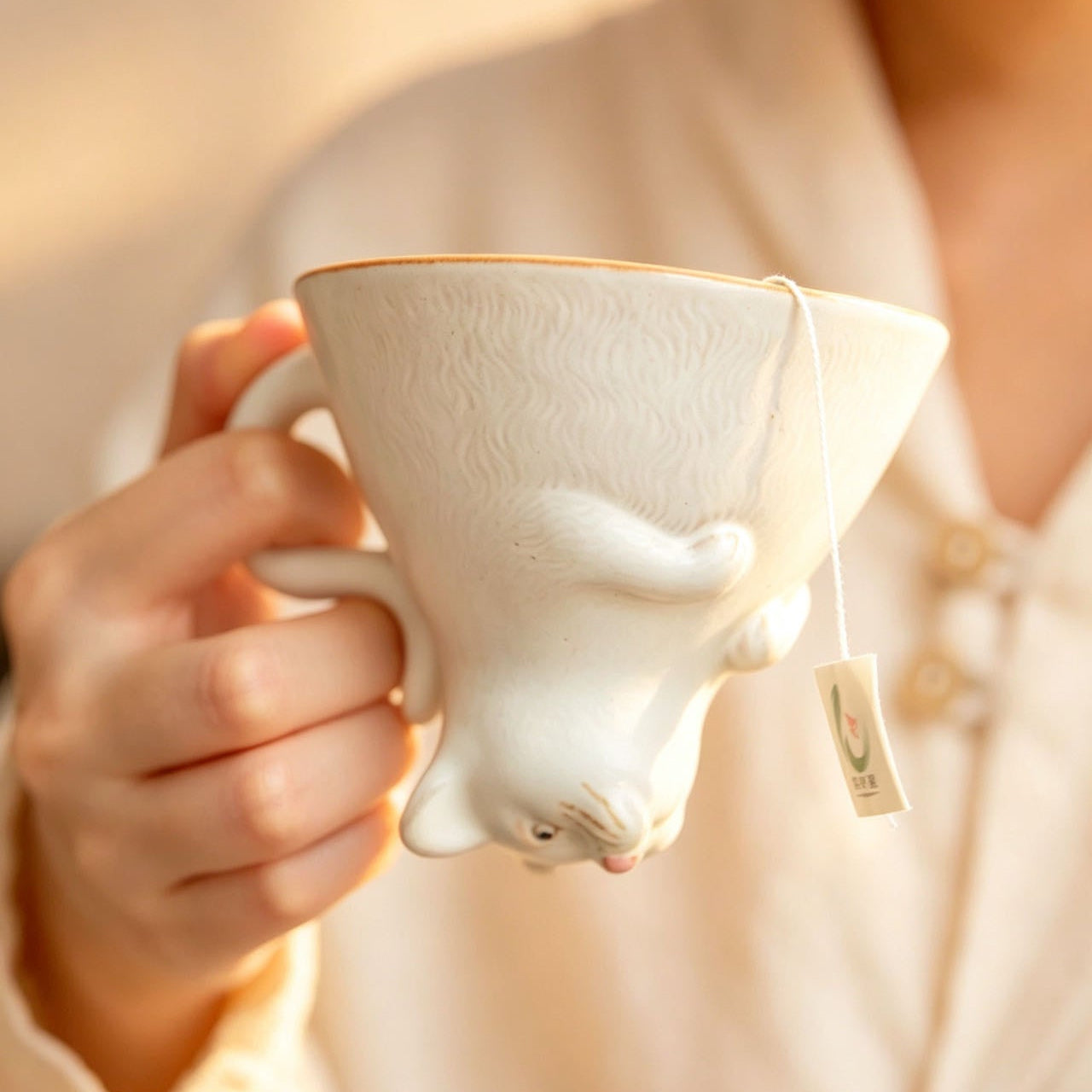 Shino ware tea cup in use — hand-polished handle, smooth comfortable grip, 125ml, MeowCeramics