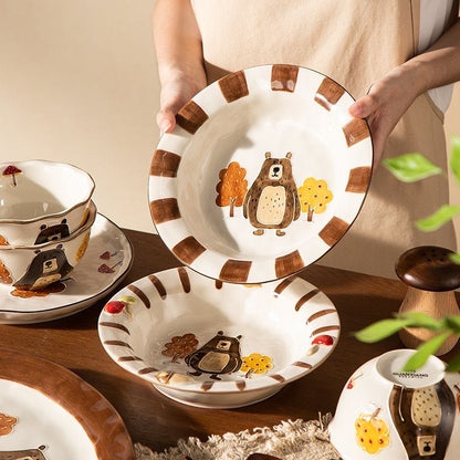 Ceramic plates with bear illustrations on a wooden table