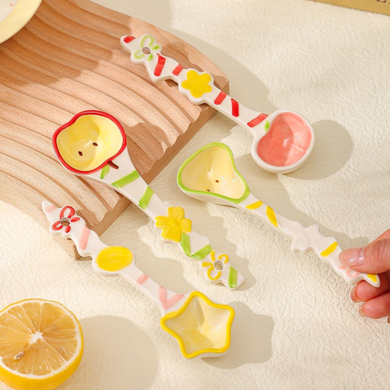 Fruit candy spoon handle detail — hand-painted candy-stripe pattern, underglaze, food-safe, MeowCeramics