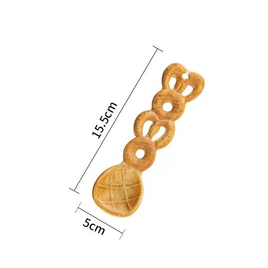 Wheat Ring Croissant ceramic spoon — 3D croissant-textured handle, warm brown glaze, MeowCeramics