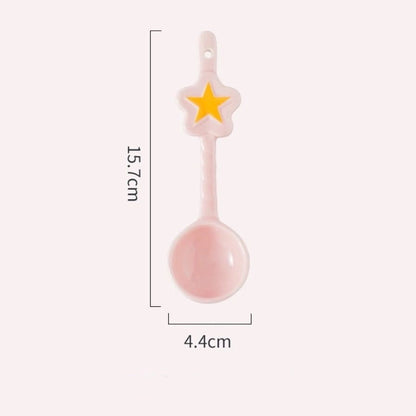Pink spoon with star decoration and measurements on a white background