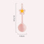 Pink spoon with star decoration and measurements on a white background