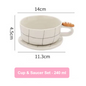 Ceramic cup and saucer set with measurements on a white background