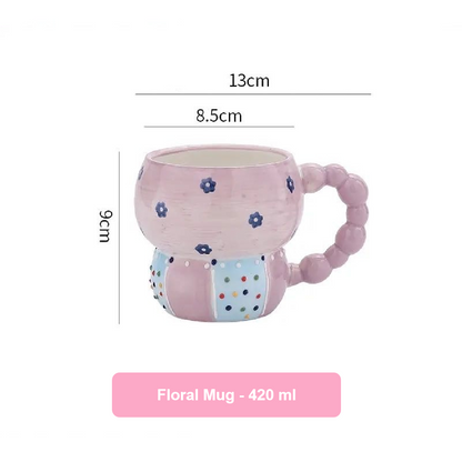 Pink floral mug with measurements on a white background