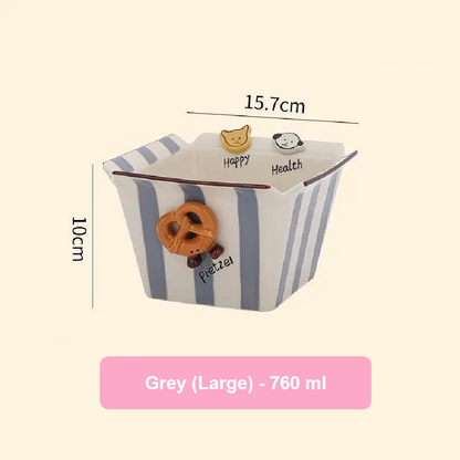 Gray pet bowl with cartoon characters and measurements on a beige background