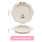Scalloped edge plate with cartoon designs and measurements on a white background