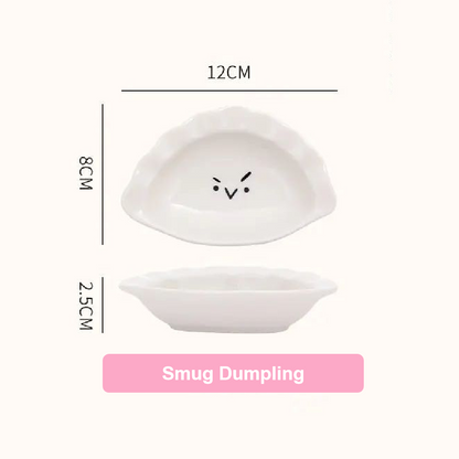 White ceramic plate with 'Smug Dumpling' design and measurements on a white background