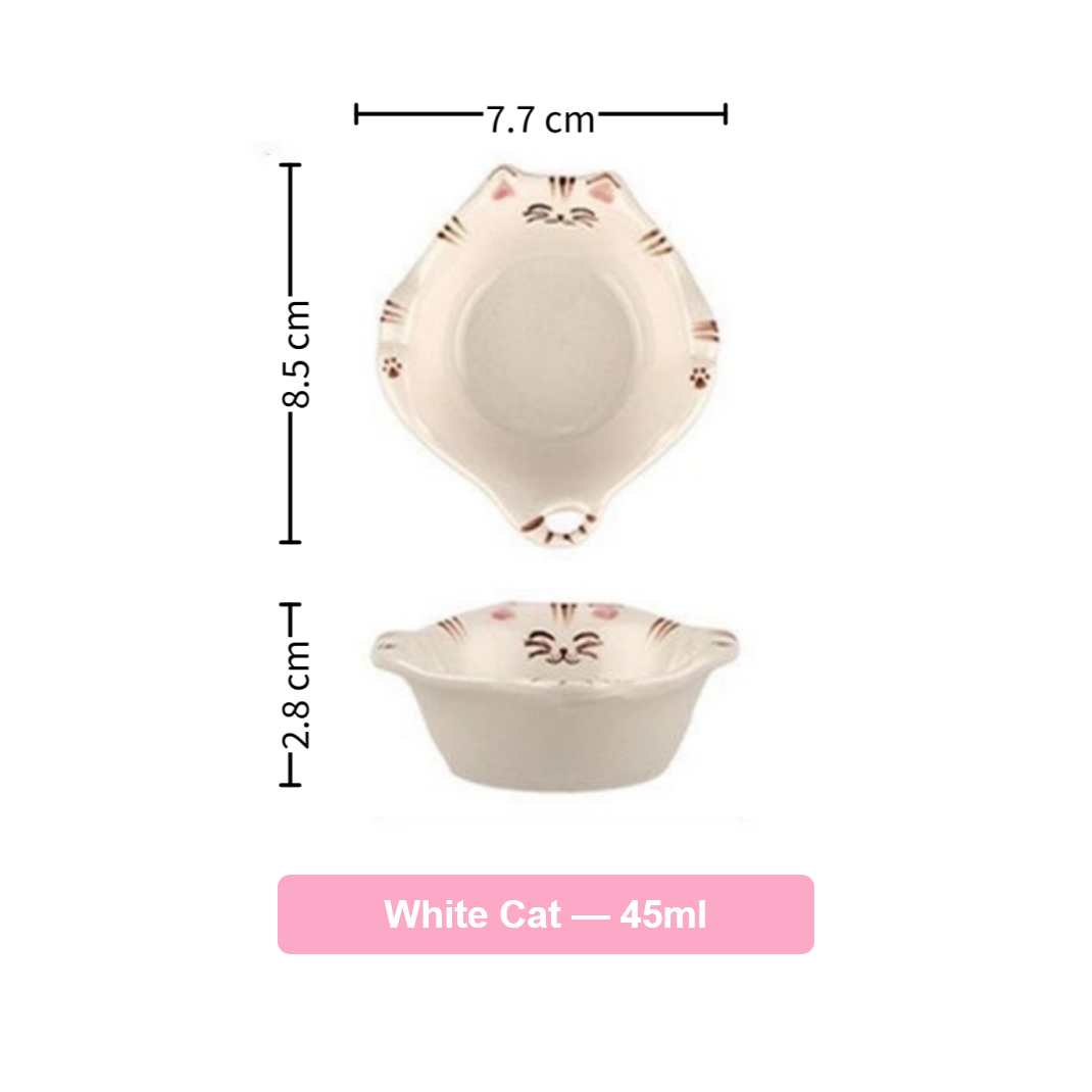 Ceramic bowl with cat design and measurements on a white background