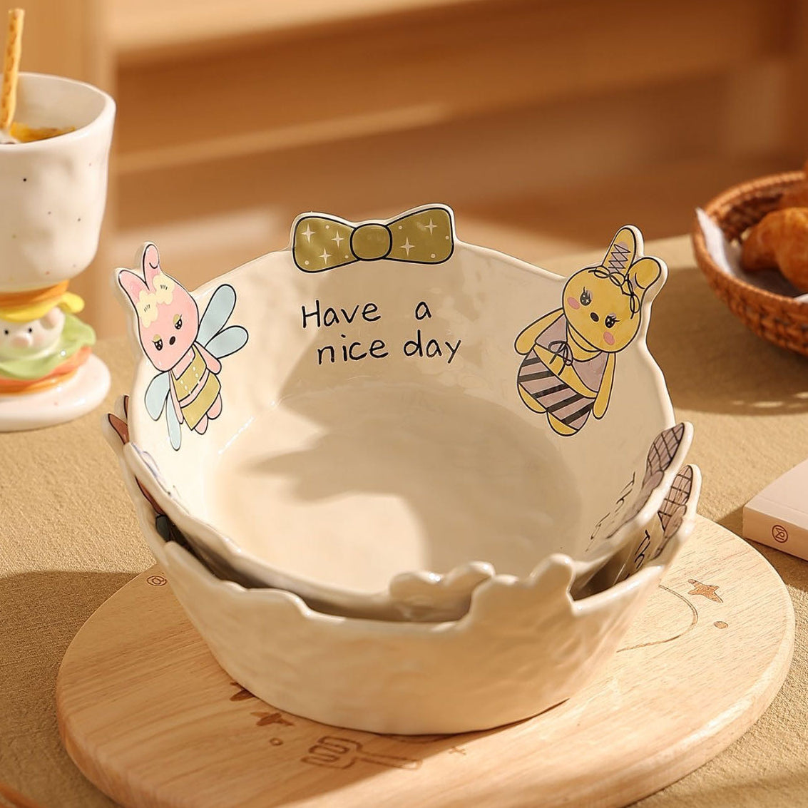 Ceramic bowl with cartoon RABBIT design and 'Have a nice day' text on a wooden surface.