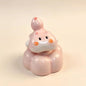 Handmade spinning pink cat ceramic figurine — lifestyle display, rotating desk ornament, MeowCeramics
