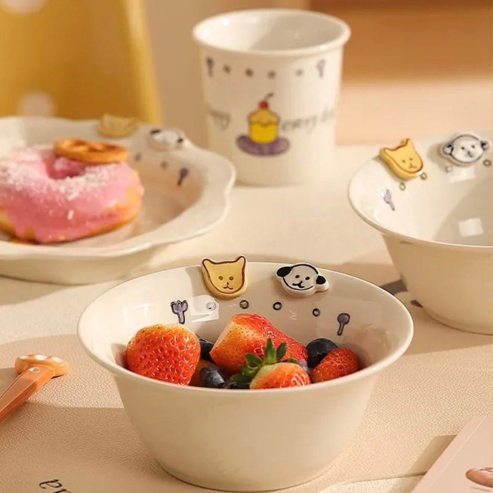 Bowl with strawberries on a table with a cup and donut in the background