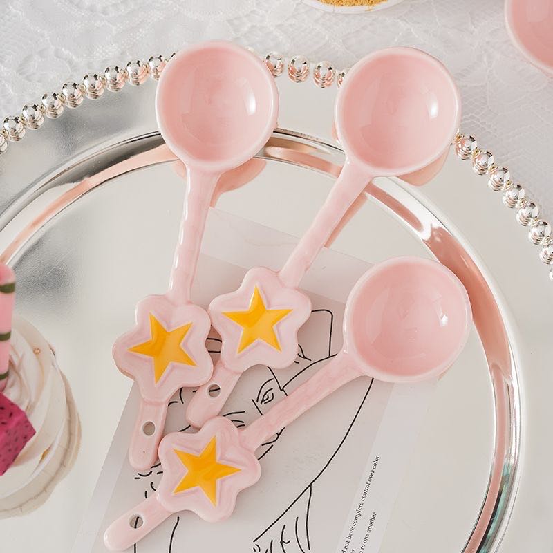 Sakura pink star ceramic dessert spoon — lifestyle display, MeowCeramics