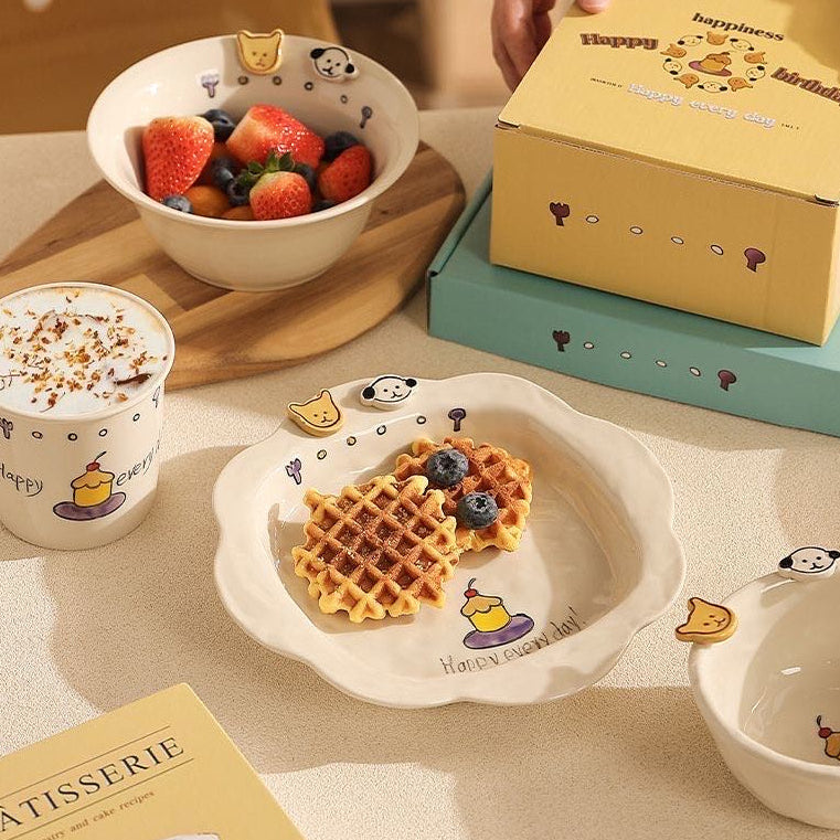Table setting with waffles, berries, and a box on a light surface.