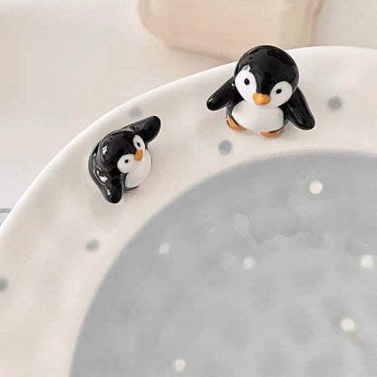 3D hand-pinched penguin figurines on ceramic plate rim — unique artisan detail, MeowCeramics