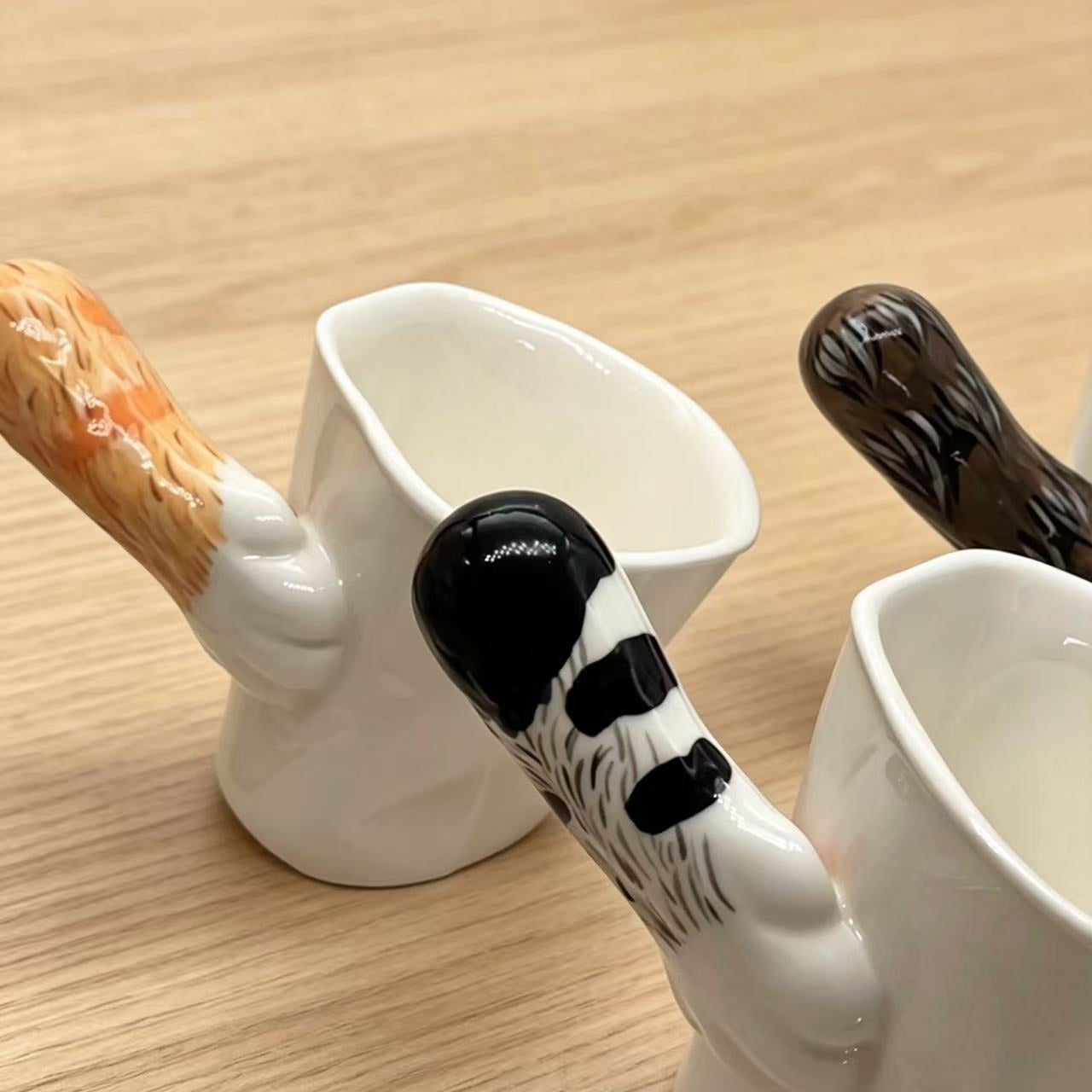 Handmade cat paw tilt mugs — multiple color styles side view, stable tilt base detail, MeowCeramics