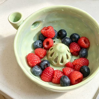Handmade ceramic swirl berry washing bowl — Mini (fresh green) and Regular (soft pink) sizes displayed together, MeowCeramics