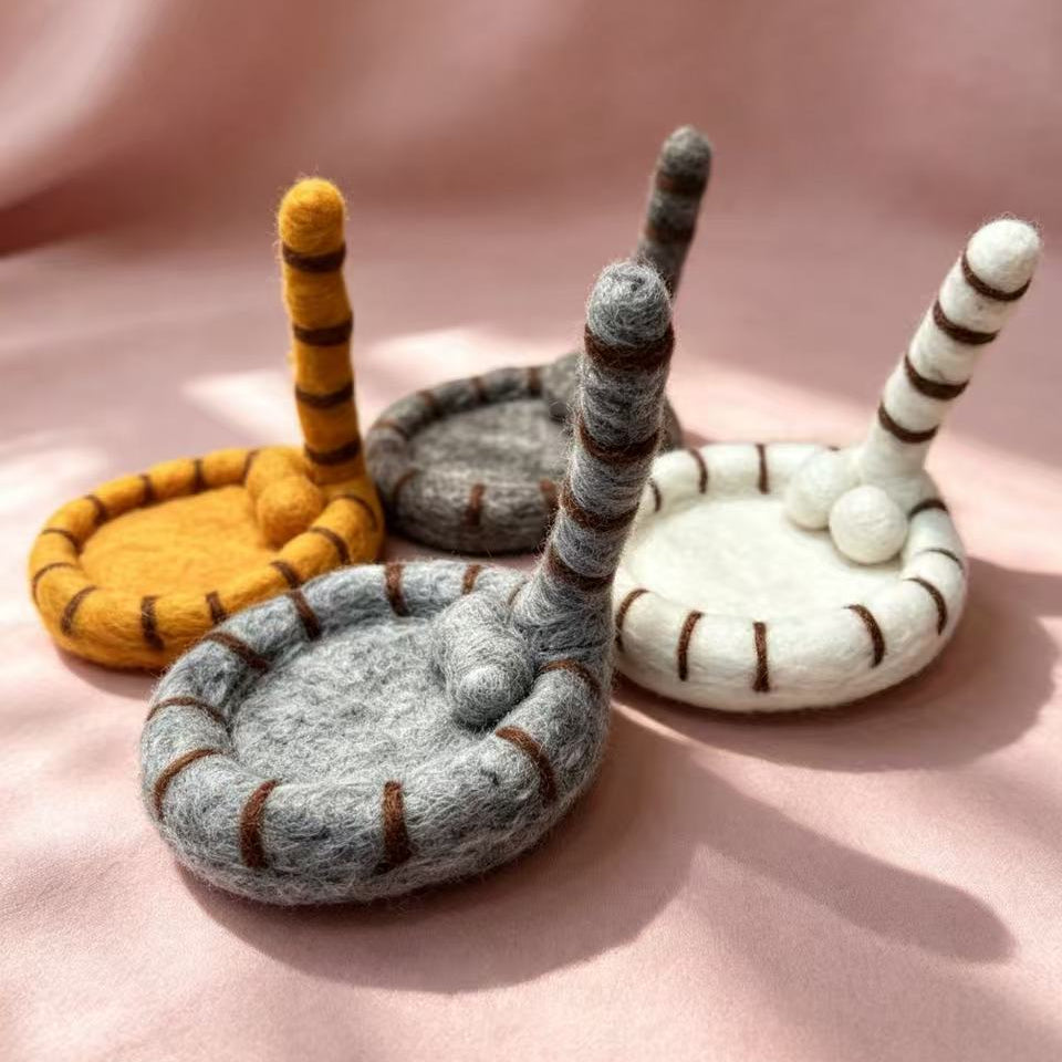 Handmade wool felt cat tail coasters — all 4 colors side view, wool felt texture detail, MeowCeramics