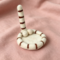 Handmade wool felt cat tail coaster — cream white variant display, MeowCeramics