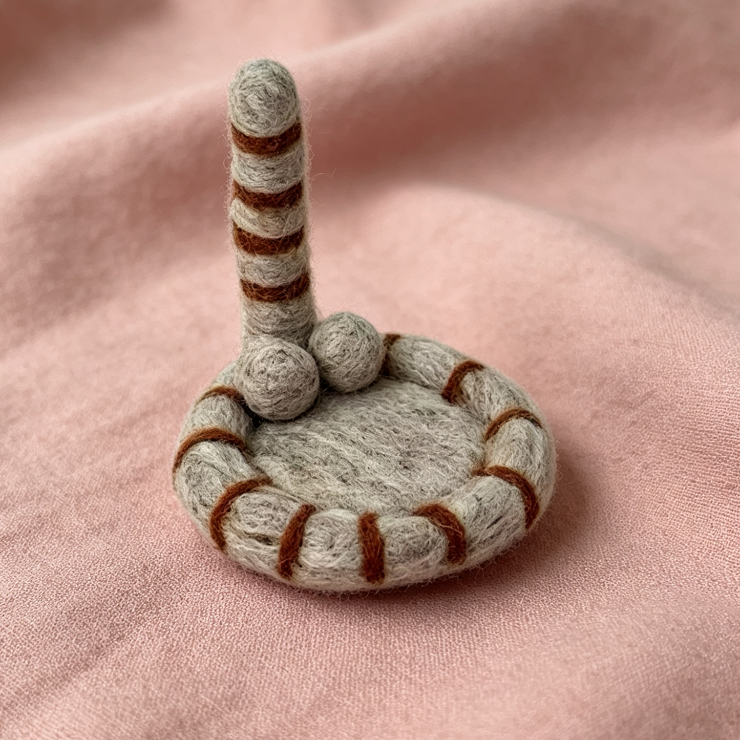 Handmade wool felt cat tail coaster — light grey variant display, MeowCeramics