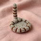 Handmade wool felt cat tail coaster — light grey variant display, MeowCeramics